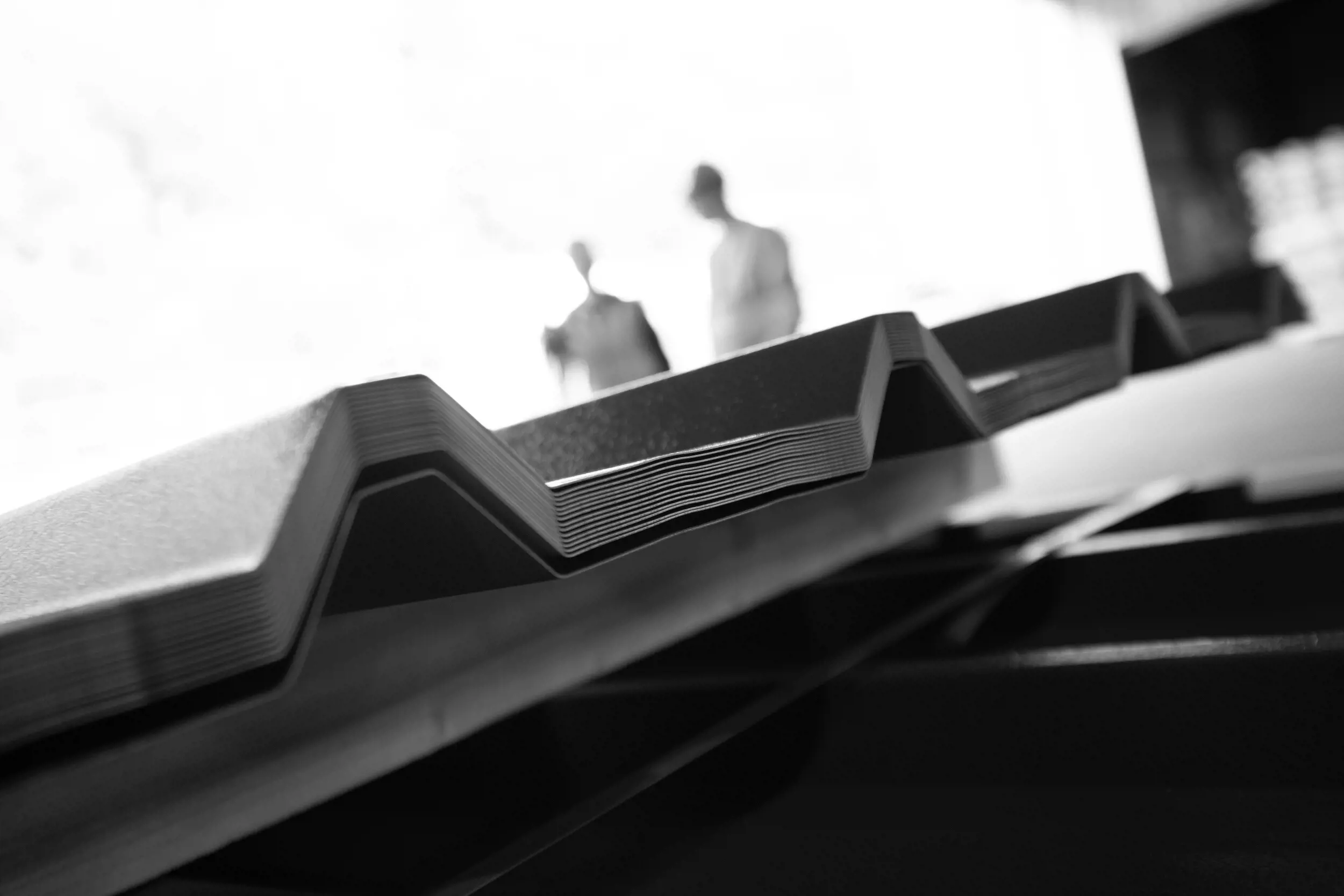 Abstract greyscale image of corrugated steel